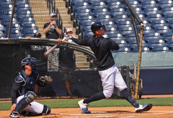 Aaron Judge takes a swing during batting practice during spring training.